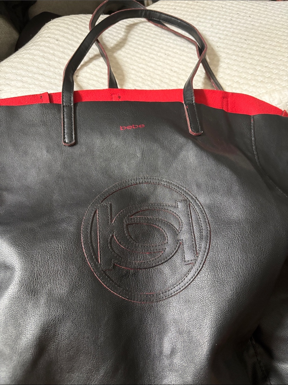 bebe Black Tote with Red Trim and Embossed Logo